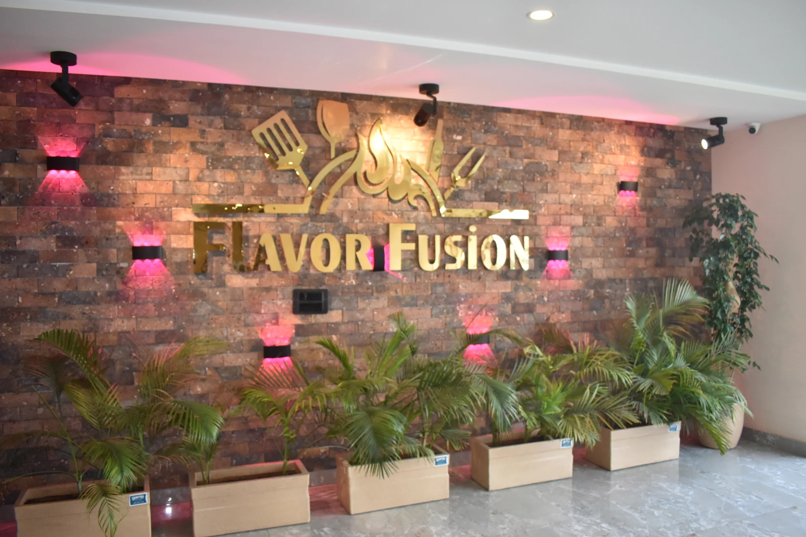 Flavor Fusion entrance sign surrounded by plants