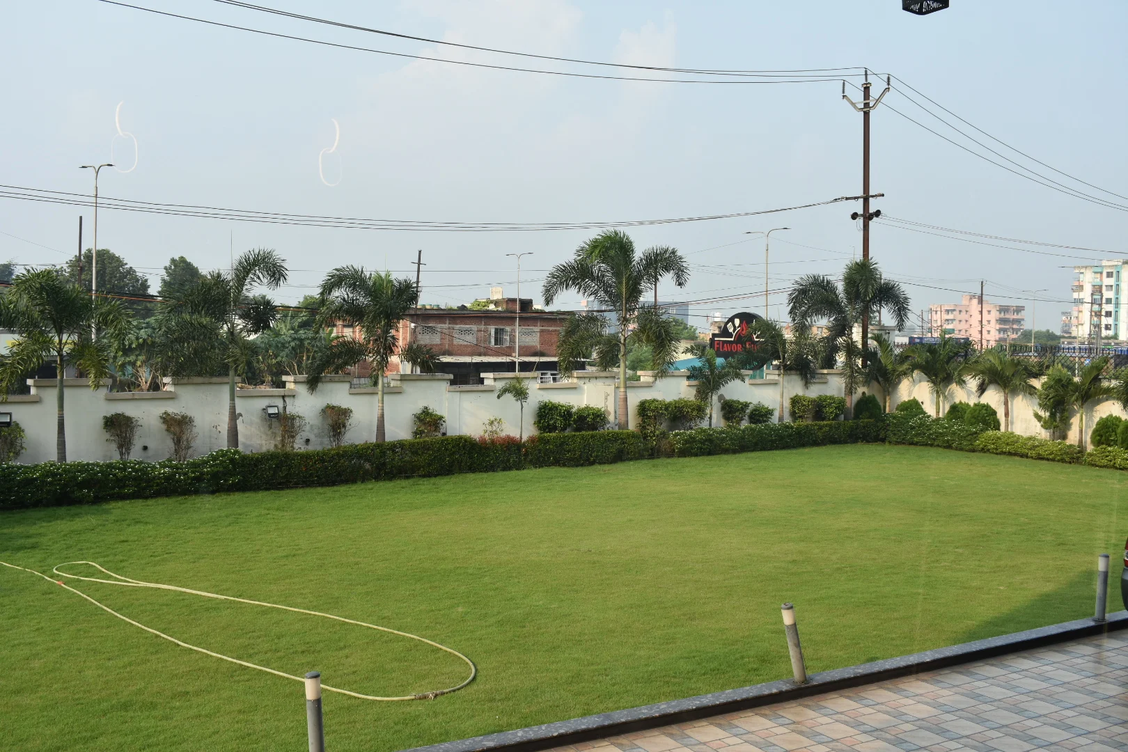 A wide view across the open green Oasis lawn